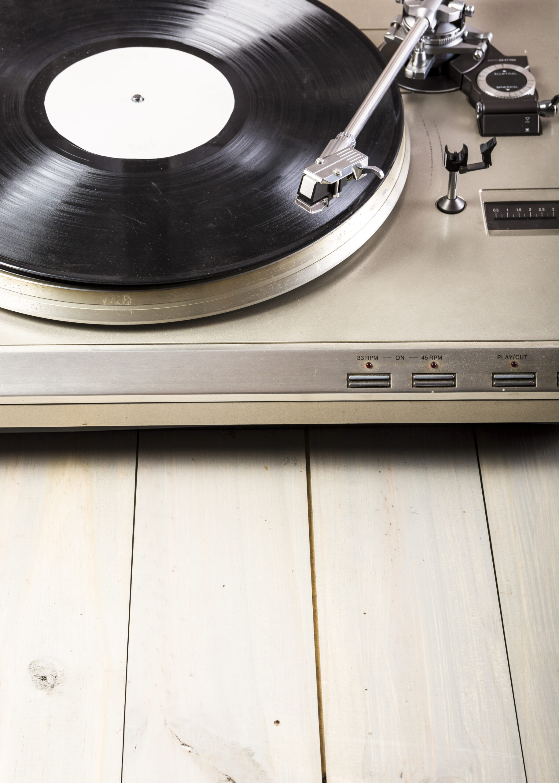 close-up-turntable-vinyl-record-player-wooden-table